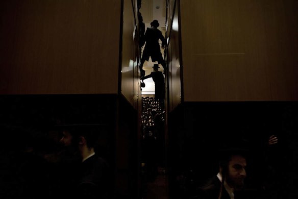 Ultra-Orthodox Jewish men gather at a yeshiva, a rabbinical seminary.