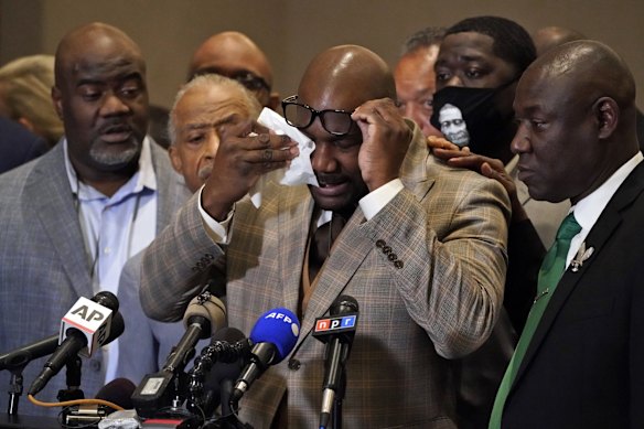 George Floyd's brother Philonise Floyd wipes his eyes during a news conference