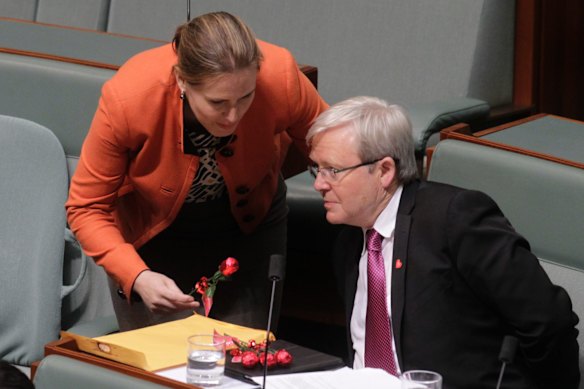 Kelly O'Dwyer Liberal backbencher gives a chocolate rose to Kevin Rudd ALP backbencher on Valentines Day during question time in Canberra on Thursday 14 February 2013. Photo: Andrew Meares