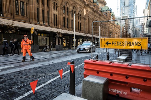 Construction for the light rail continues outside the QVB building on George Street near the intersection of Park Street.
