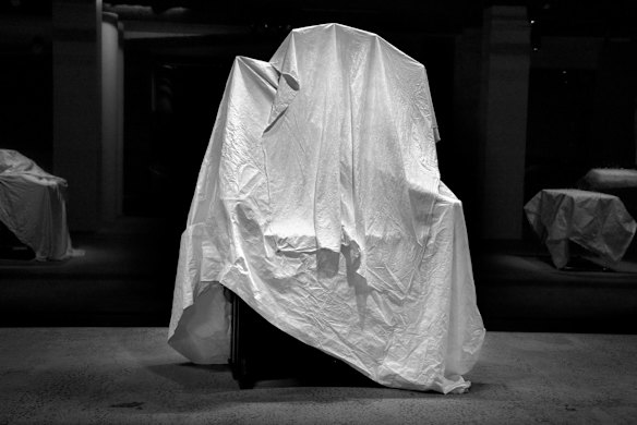 Keyboards which are part of the "Electric Keys" Exhibition which have been covered and protected from dust and sunlight in the Powerhouse Museum, Ultimo.
