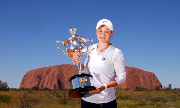 Posing with the Daphne Akhurst Memorial Cup as she visited Uluru in February.