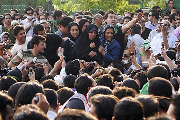 Faezeh Rafsanjani (C), daughter of former Iranian president Akbar Hashemi Rafsanjani, attends an opposition rally in Tehran in this June 16, 2009 photograph made available June 21, 2009. 