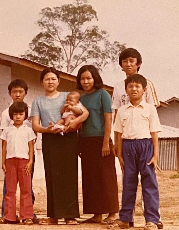 Richard Lim (back right) in 1980 at Phanat Nikhom refugee camp in Thailand, with youngest brother Ty Lim (back left), sister Kheng Lim (holding baby) and other relatives.