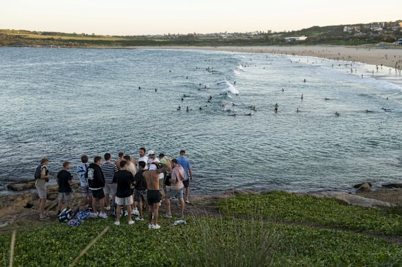 Social distancing is not on the agenda for this crowd in Maroubra on Friday May 8.