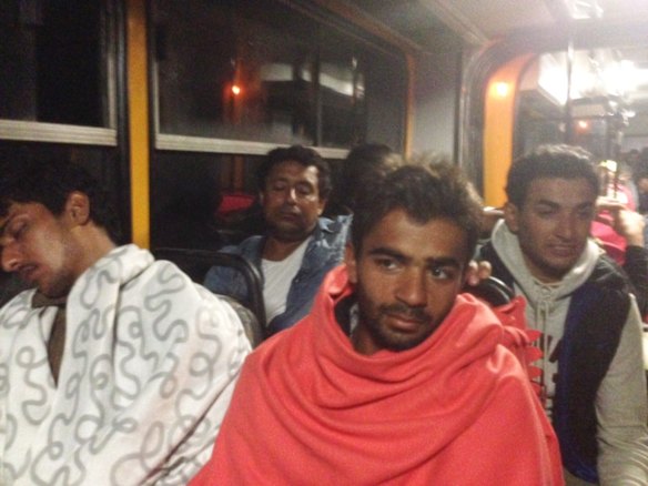 Migrants board buses said to be bound for Austria outside Keleti station in central Budapest, Hungary.
