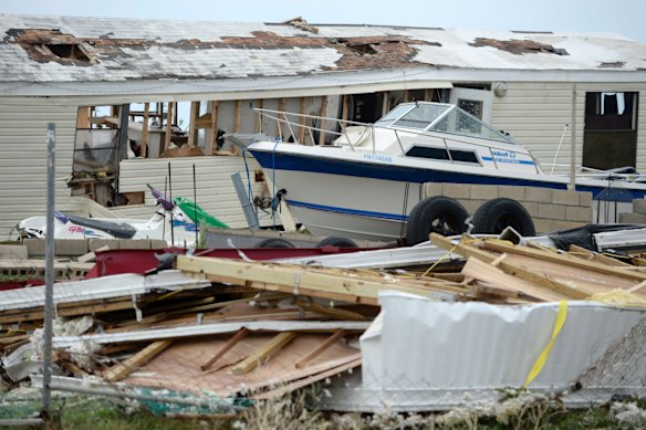 A pleasure boat stands next to a destroyed home after the passing of Hurricane Irma, in Culebra, Puerto Rico.