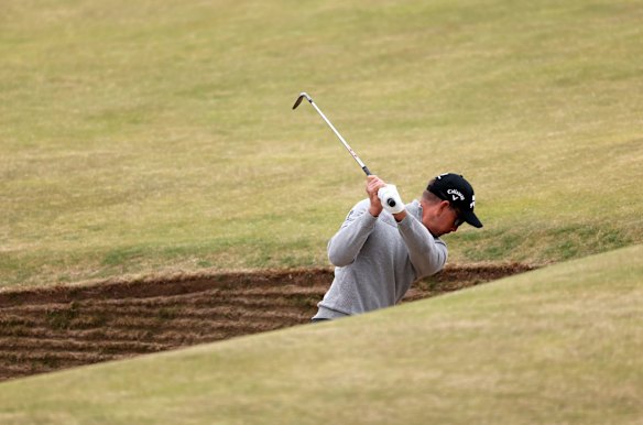 Henrik Stenson, who gave up his Ryder Cup captaincy to sign with LIV, plays out of a bunker on the 13th hole at the 150th Open at St Andrews.