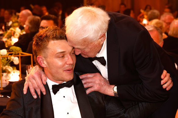 Legends: Patrrick Cripps is embraced by fellow Blues great John Nicholls.