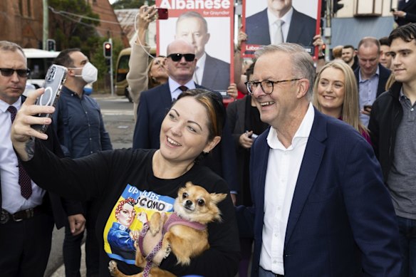 Opposition Leader Anthony Albanese takes a selfie as he arrives to cast his vote at the Marrickville Library in Sydney.