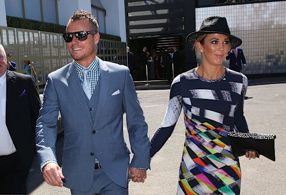 Lleyton Hewitt and Bec Hewitt arrive at the Swisse Marquee on Melbourne Cup Day.
