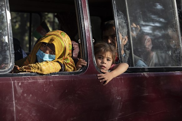 Displaced Afghans from the northern provinces are evacuated from a makeshift IDP camp in Share-e-Naw park to various mosques and schools on August 12, 2021 in Kabul, Afghanistan. People displaced by the Taliban advancing are flooding into the Kabul capital to escape the Taliban takeover of their provinces.