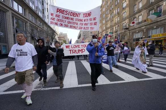Supporters of President Donald Trump walk to Freedom Plaza on Saturday. 