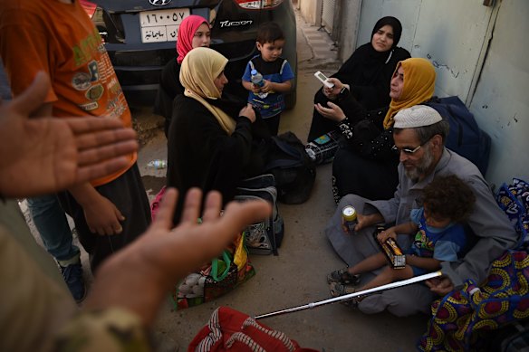 Moments after people have been rescued by Iraqi forces and arrive safely at a screening point in West Mosul.