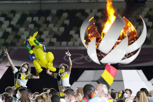 Australia's Sarah Carli, right, attends the closing ceremony in the Olympic Stadium at the 2020 Summer Olympics in Tokyo, Japan.