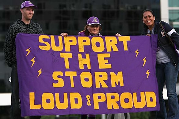 Melbourne Storm fans show their support for the club during their first match since their competition points were stripped for salary cap breaches.