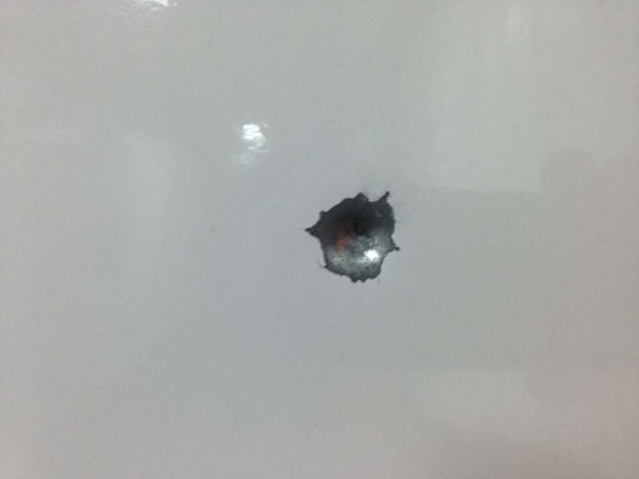 Manus Island scenes of where Asylum seekers are detained before and after recent riots. Bullet hole in room.