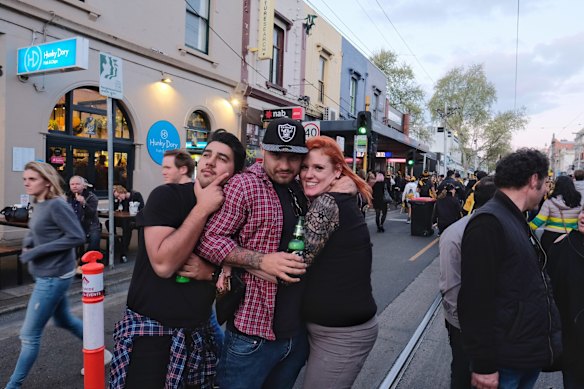 Richmond supporters celebrating their teams win over Adelaide during the AFL Grand Finals in Swan st Richmond. photo Luis Enrique Ascui