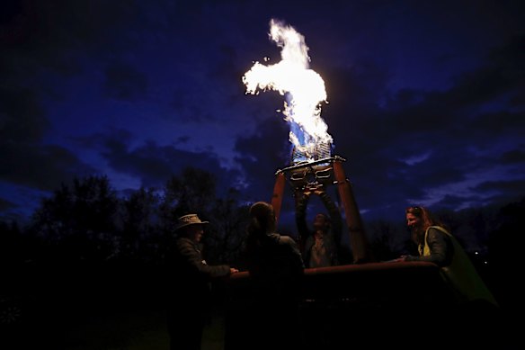 Hot air balloons inflating on the lawns in front of Old Parliament House for the Canberra Balloon Spectacular festival.