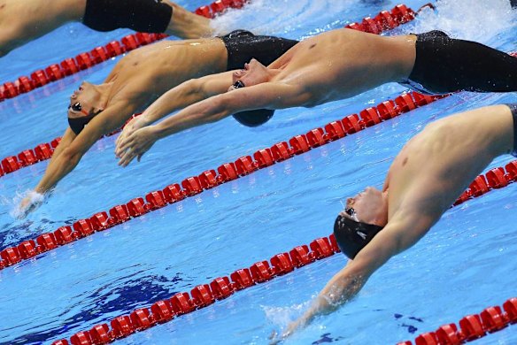Tyler Clary (front) of the US, Ryan Lochte of the US (centre) and Japan's Ryosuke Irie (back) start their men's 200m backstroke final.