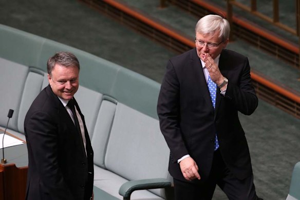 Kevin Rudd and Joel Fitzgibbon depart after question time at Parliament House.