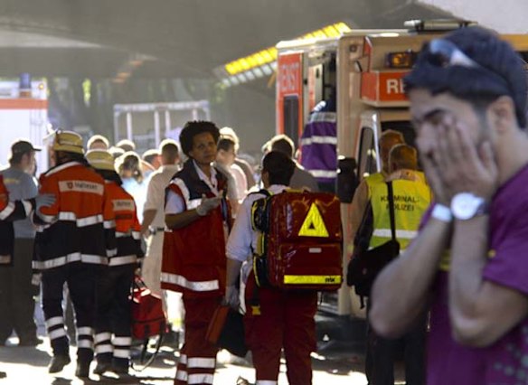 A man at the site where a stampede killed up to 18 people during a festival in Duisburg, Germany.