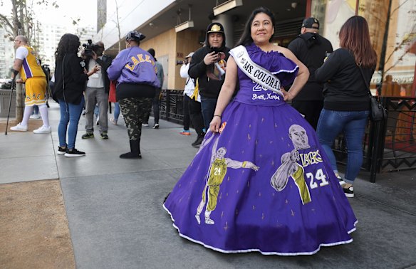 A fan wears a Kobe-themed dress outside the Celebration of Life for Kobe and Gianna Bryant memorial service at Staples Center.