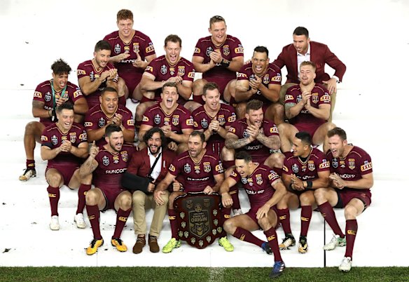 Queensland celebrate with the trophy after game three of the State Of Origin series.