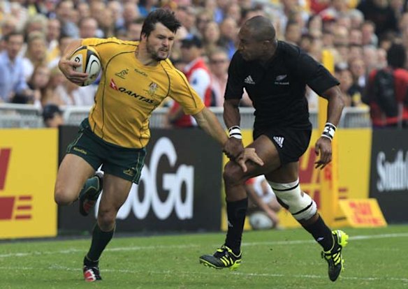 Adam Ashley-Cooper runs past Joe Rokocoko.