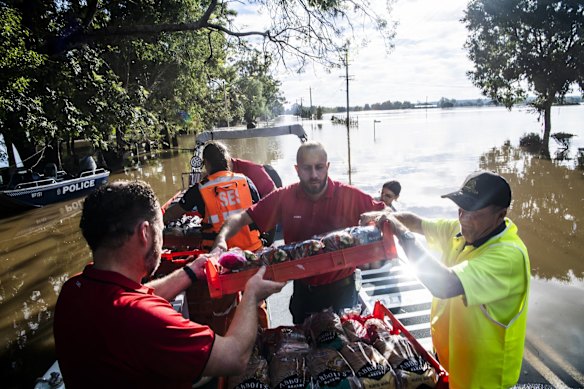 SES Volunteers delivering urgent food and medical supplies in George Street, Windsor on Thursday morning.