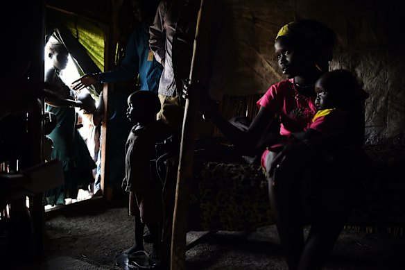 Nyapina Gattang, 20, with her 12 month old baby daughter Nyaguande Bol in their shelter inside the UN Bentiu Protection of Civilians (POC) site, Bentiu, Unity State, South Sudan. 