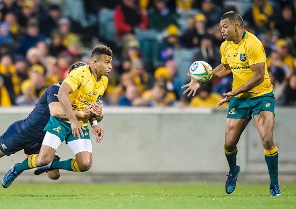 Wallabies scrumhalf Will Genia gets a pass away to Kurtley Beale.