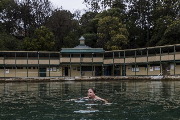 Lifeguard Darren Thorne braves the cool waters of the Dawn Fraser Baths, which require millions of dollars of repairs due, in part, to the effects of climate change, according to Inner West councillor Rochelle Porteous.