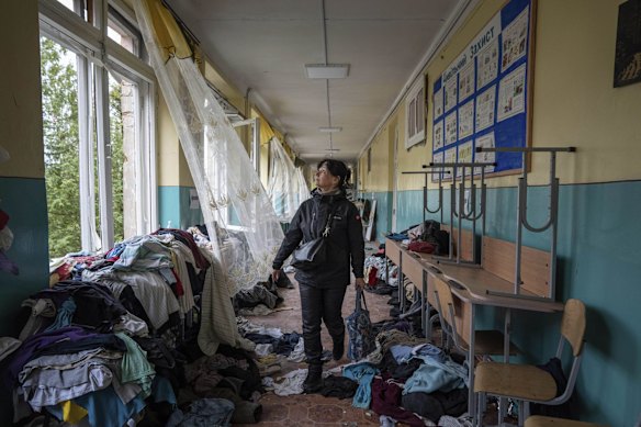 School director Iryna Homenko in the hall of a school bombed during a Russian air strike in Chernihiv.