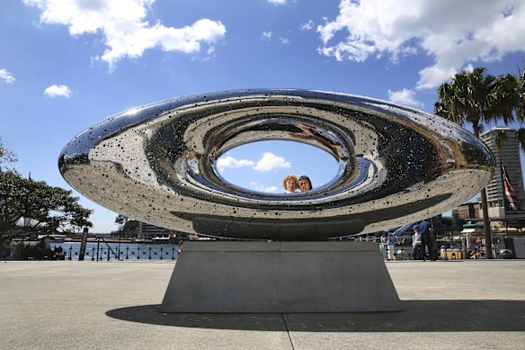 Liz Ann Macgregor and artist Lindy Lee and her sculpture 'Secret World of a Starlight Ember' installed in the forecourt at the MCA Gallery, Sydney.