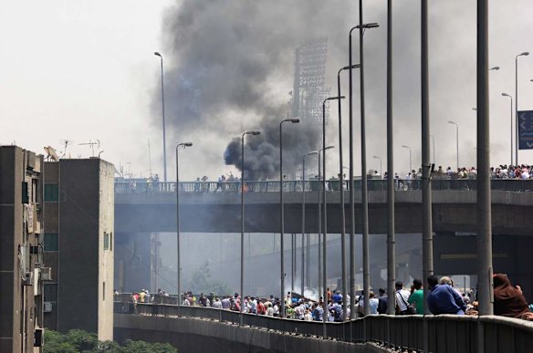 Supporters of Egypt's ousted President Mohammed Morsi clash with security forces near the largest sit-in by supporters of Morsi in the eastern Nasr City district of Cairo, Egypt.