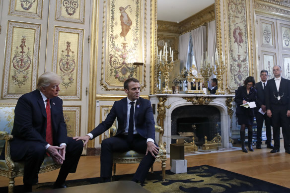Macron placed his hand on Trump's knee and referred to him as "my friend".
