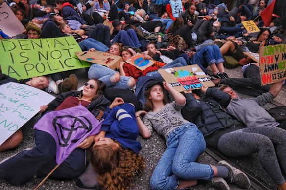 Protesters take part in the Climate Emergency XR Snap Rally in Melbourne.