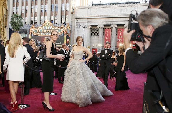 Amy Adams, best supporting actress nominee for her role in "The Master," arrives wearing an Oscar de La Renta dress.