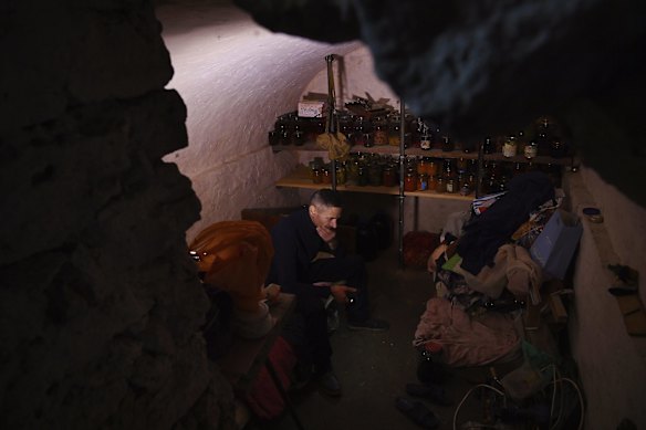 Serhiy, 39, sits in his bomb shelter where he sleeps. His home in Novooleksandrivka village, Kherson Oblast, was severely damaged by missile strikes on October 14. Serhiy spent years renovating his home and now hopes to rebuild. Novooleksandrivka was liberated from Russian occupation on October 3. The village has no power, no gas, no water and shops are closed. Residents rely on food from their gardens, humanitarian aid and water trucks bringing in drinkable water. 
