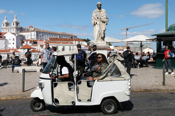 One of the hundreds of three-wheeled tuk-tuks taking tourists around Lisbon's sights. 