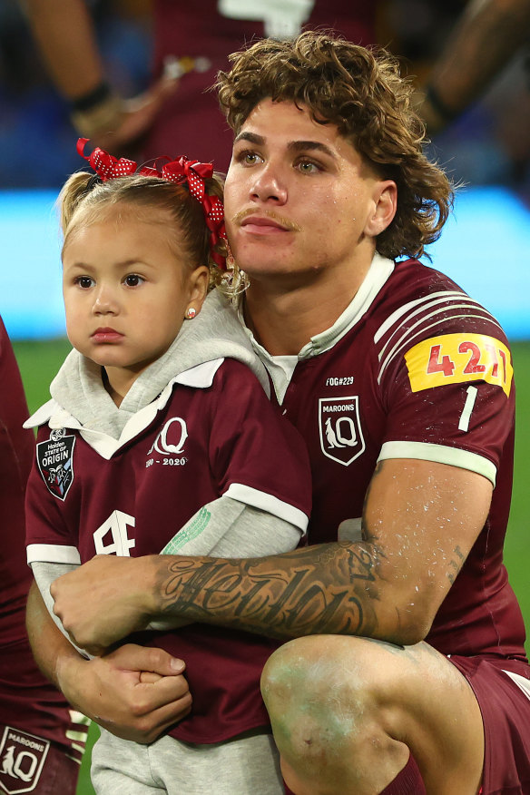 Reece Walsh with his daughter Leila after Queensland lost the series.