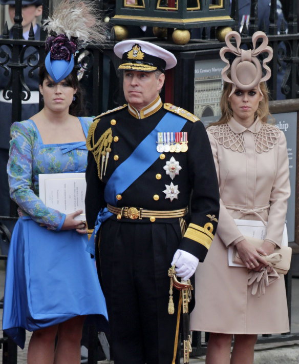 Prince Andrew and his daughters Princess Eugenie, left, and Princess Beatrice leave Westminster Abbey at the wedding of Prince William and Catherine, the Duchess of Cambridge, in 2012.