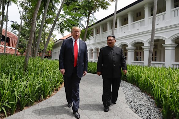 U.S. President Donald Trump and North Korea leader Kim Jong Un walk from their lunch at the Capella resort on Sentosa Island.