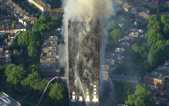 In this photo taken from video, smoke rises from a high-rise apartment building on fire in London, Wednesday, June 14, 2017. 