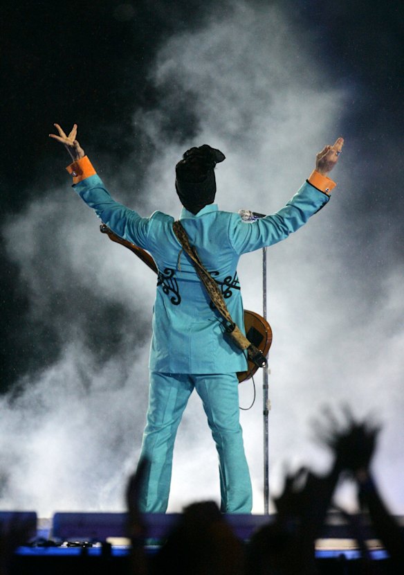 Prince performs during the halftime show at Super Bowl XLI at Dolphin Stadium in Miami in 2007. 