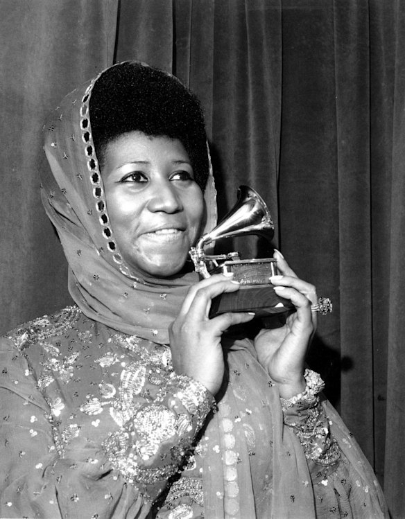 In this March 3, 1975 file photo, singer Aretha Franklin poses with her Grammy Award for best female R&B vocal performance for "Ain't Nothing Like the Real Thing" at the 17th Annual Grammy Award presentation in New York. 