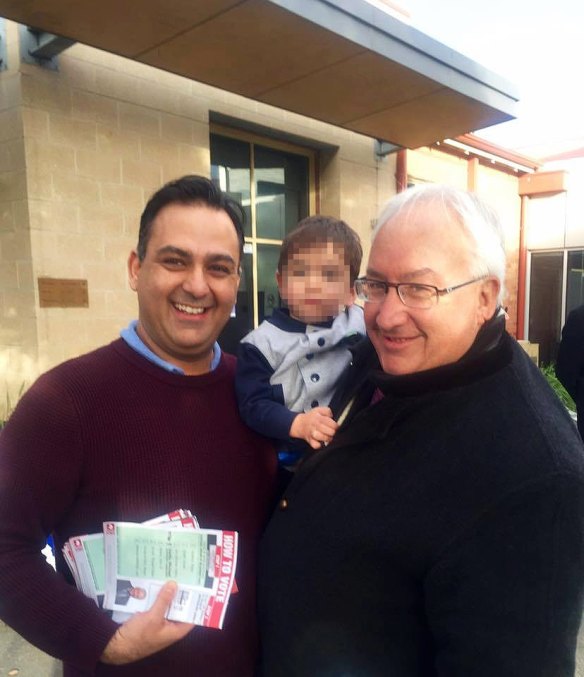 George Droutsas with Michael Danby and a stack of how-to-vote cards. 