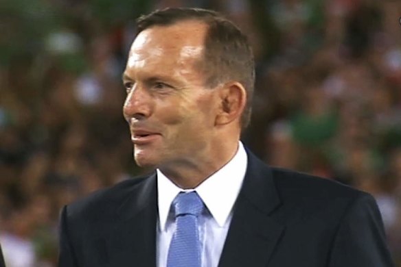Tony Abbott looks bemused when being booed at the 2014 NRL grand final.