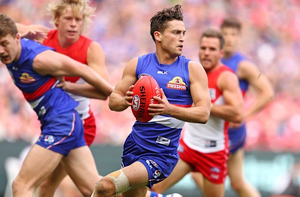  Luke Dahlhaus of the Bulldogs runs with the ball during the 2016 Toyota AFL Grand Final